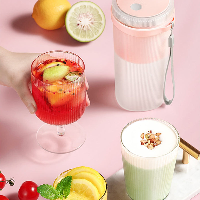 PulseMix GoBottle blending a fruit smoothie on the go